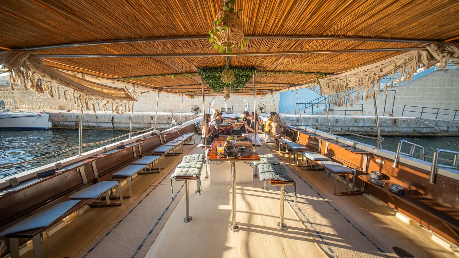 Covered wooden deck seating aboard Guadalupe